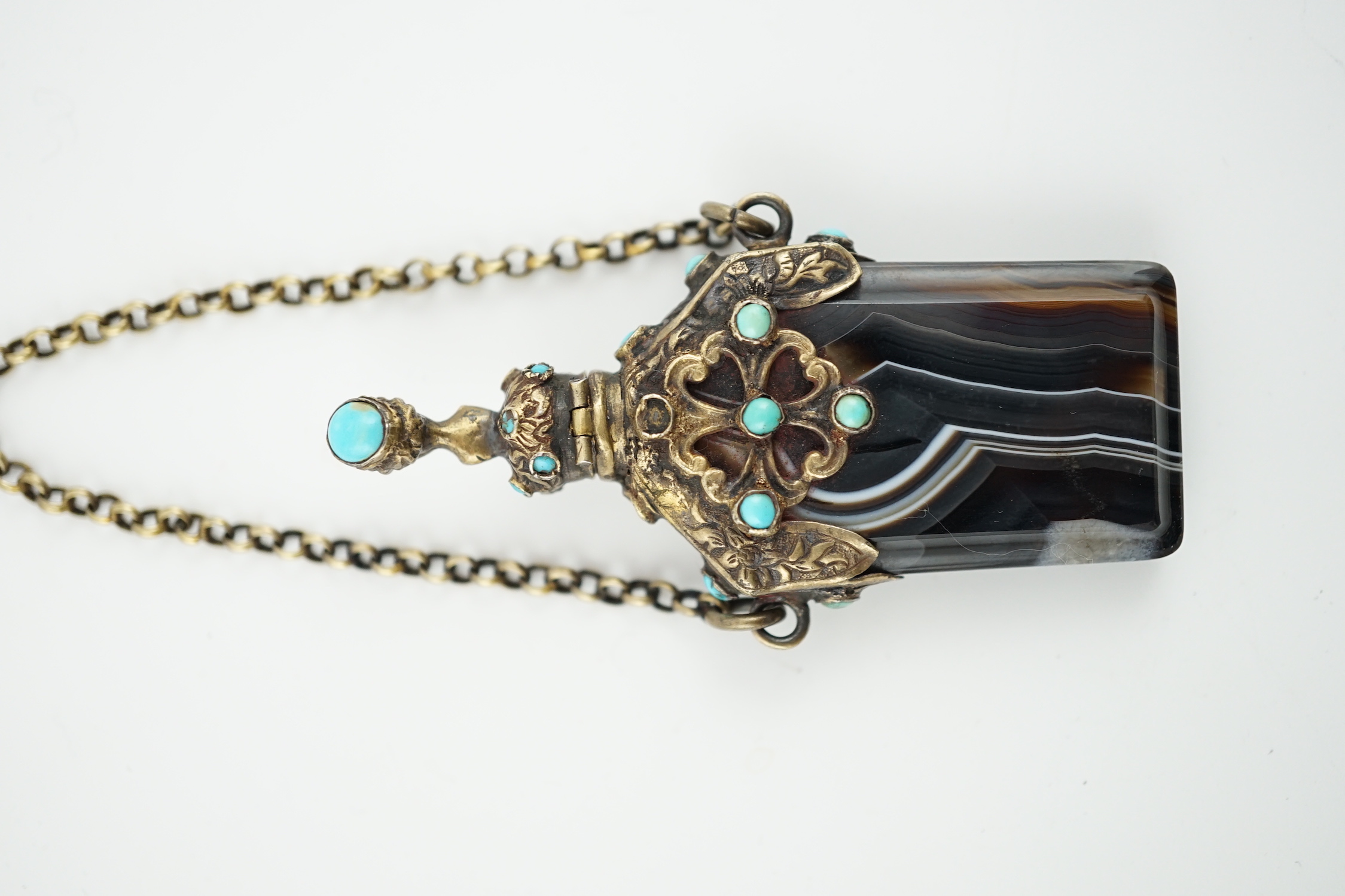A 19th century continental gilt metal and turquoise cabochon set banded agate scent bottle